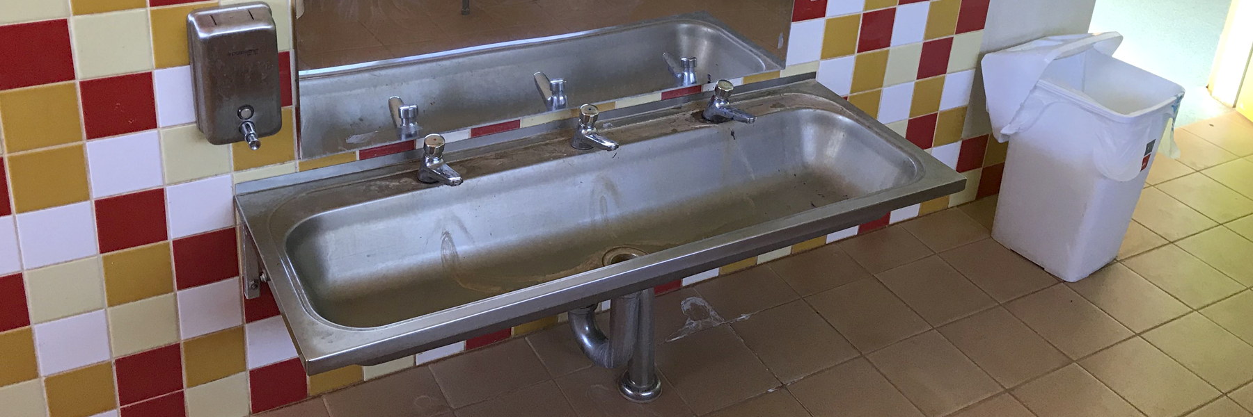 clean taps and sink at a school