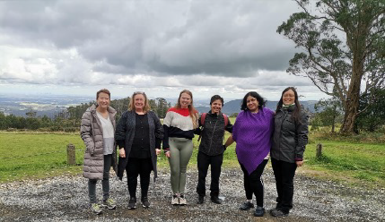 Black Saturday Bushfires Memorial Six women standing in a row, in country Victoria