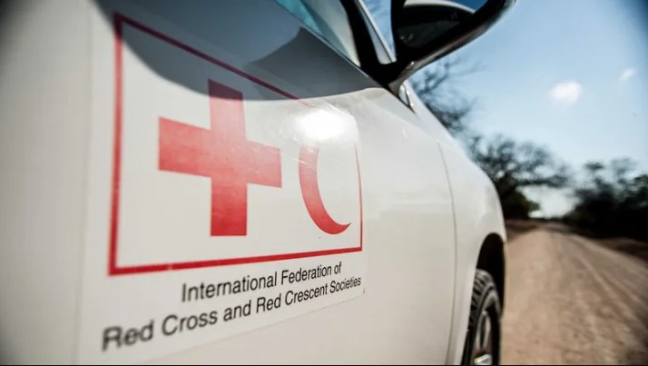 The door of a white SUV with the International Federation of Red Cross and Red Crescent  logo