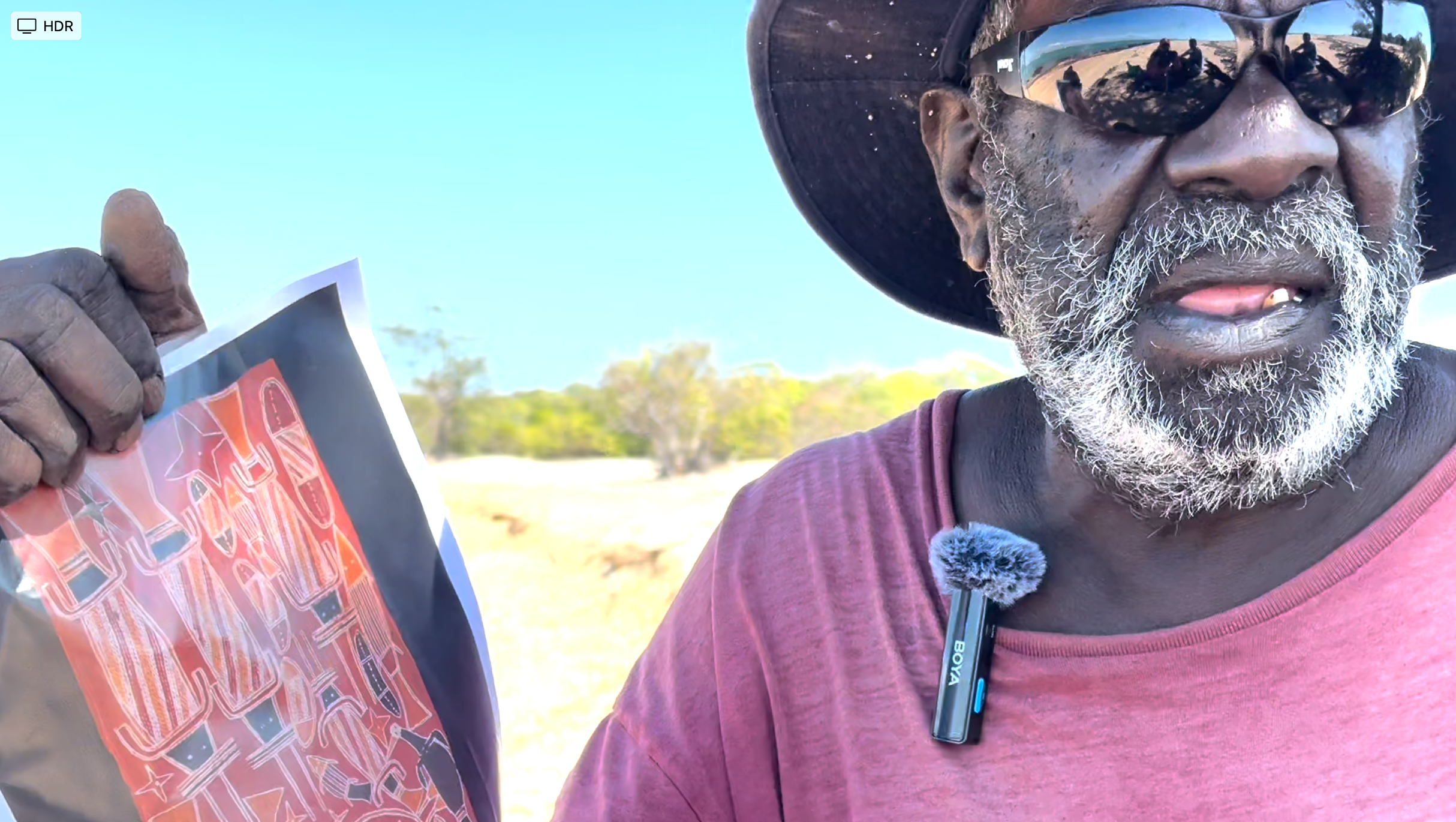 Michael Mungula is holding a painting by his father Djäwa, part of the musée du quai Branly Karel Kupka collection. 